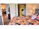 Bright main bedroom with large king size bed and view to connected kitchen and bathroom at 433 Cerromar Ln # 331, Venice, FL 34293