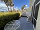 Inviting patio features a glass table and chairs overlooking the lush green golf course at 433 Cerromar Ln # 331, Venice, FL 34293