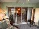 Screened-in porch with tile floors and sliding glass door to main living area at 433 Cerromar Ln # 331, Venice, FL 34293