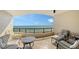 Inviting outdoor balcony with ocean views and comfortable seating at 435 L Ambiance Dr # K506, Longboat Key, FL 34228