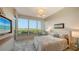 Cozy bedroom with large windows showcasing ocean and coastal views, complete with stylish decor at 435 L Ambiance Dr # K506, Longboat Key, FL 34228