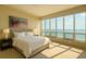 Inviting bedroom featuring expansive windows with stunning ocean views and ample natural light at 435 L Ambiance Dr # K506, Longboat Key, FL 34228