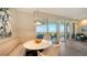 Cozy breakfast nook with comfortable seating and scenic views from the nearby sliding glass doors at 435 L Ambiance Dr # K506, Longboat Key, FL 34228