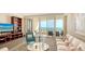 Relaxing living room with plush seating and expansive ocean views from the balcony at 435 L Ambiance Dr # K506, Longboat Key, FL 34228