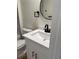 Modern bathroom vanity with undermount sink, white cabinets, and black hardware at 4613 Muirfield Dr, Bradenton, FL 34210