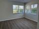 Bedroom with hardwood flooring and windows providing an abundance of natural light at 4613 Muirfield Dr, Bradenton, FL 34210