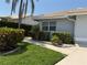 Landscaped front yard with lush greenery, and well-manicured bushes at 4613 Muirfield Dr, Bradenton, FL 34210