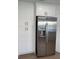 Stainless steel refrigerator with water dispenser and white shaker cabinets in this contemporary kitchen at 4613 Muirfield Dr, Bradenton, FL 34210