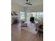 Bright living room with vaulted ceiling and a sliding glass door leading to an outdoor area at 4613 Muirfield Dr, Bradenton, FL 34210