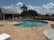 Sparkling community pool with a brick patio and lounge chairs for residents at 4613 Muirfield Dr, Bradenton, FL 34210