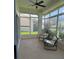 Relaxing sunroom with tiled floor, multiple windows providing natural light, and comfortable seating at 4613 Muirfield Dr, Bradenton, FL 34210