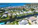 Panoramic aerial view of waterfront homes with canal access to bay and community amenities at 4726 Potomac Cir, Bradenton, FL 34210