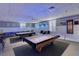 Game room featuring billiard tables and lounge seating at 4726 Potomac Cir, Bradenton, FL 34210