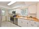 Well-lit kitchen featuring stainless steel appliances and wood countertops at 4726 Potomac Cir, Bradenton, FL 34210