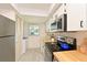 A functional kitchen featuring bright and spacious cabinets and appliances at 4726 Potomac Cir, Bradenton, FL 34210
