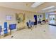 Bright lobby area with comfortable seating, decorative mirror and art at 4726 Potomac Cir, Bradenton, FL 34210