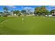 Manicured putting green providing a space for golf enthusiasts to practice their skills at 4726 Potomac Cir, Bradenton, FL 34210