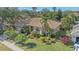 Charming home with a well-manicured lawn, mature landscaping, and a welcoming facade at 4978 Cedar Oak Way, Sarasota, FL 34233