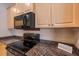 Close up of a kitchen with granite countertops and a range at 4978 Cedar Oak Way, Sarasota, FL 34233