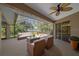 Enjoy outdoor living on this spacious screened-in lanai with comfortable seating at 4978 Cedar Oak Way, Sarasota, FL 34233