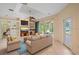 Comfortable living room with lake views, with cozy seating at 4978 Cedar Oak Way, Sarasota, FL 34233