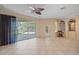 Living room with large screened patio overlooking the lake at 4978 Cedar Oak Way, Sarasota, FL 34233