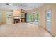 Living room with lake views and built-in shelving at 4978 Cedar Oak Way, Sarasota, FL 34233