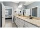 Bright bathroom features double sinks, granite countertops and modern fixtures with bedroom view at 5165 Coral Reef Way, Bradenton, FL 34211