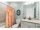 Charming bathroom featuring a colorful shower curtain, modern sink, and unique decor at 5165 Coral Reef Way, Bradenton, FL 34211