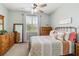 Comfortable bedroom with a metal bed frame, plenty of pillows, and natural light at 5165 Coral Reef Way, Bradenton, FL 34211