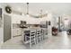 Bright kitchen featuring white cabinets, stainless steel appliances, and a spacious island with seating at 5165 Coral Reef Way, Bradenton, FL 34211