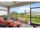 Enjoy outdoor living on this screened lanai with comfortable seating and a view of the landscaped backyard at 5165 Coral Reef Way, Bradenton, FL 34211