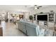 Bright open-concept living room with tile flooring, modern decor, and comfortable seating at 5165 Coral Reef Way, Bradenton, FL 34211