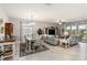 Open living and dining area with tile floors, neutral walls, and large windows for natural light at 5165 Coral Reef Way, Bradenton, FL 34211