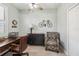 Inviting office space with ceiling fan, comfortable chair, desk, and sleek bicycle decor at 5165 Coral Reef Way, Bradenton, FL 34211