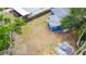 A high angle view of a backyard, fenced in, with an outdoor patio, and a view of the roof at 5307 47Th Street E Ct, Bradenton, FL 34203