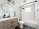 Renovated bathroom with a modern vanity and bathtub with shower at 5307 47Th Street E Ct, Bradenton, FL 34203
