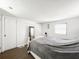 A cozy bedroom features a bed, full length mirror, and natural lighting at 5307 47Th Street E Ct, Bradenton, FL 34203