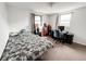 A cozy bedroom features a bed, desk, and bookshelf at 5307 47Th Street E Ct, Bradenton, FL 34203