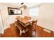 A naturally lit dining room features a bench and chairs around the wooden table at 5307 47Th Street E Ct, Bradenton, FL 34203