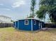 A single story home featuring blue siding and a well maintained yard at 5307 47Th Street E Ct, Bradenton, FL 34203