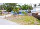 Lovely home with blue siding, bright red door, established tree in the front yard, and long driveway at 5307 47Th Street E Ct, Bradenton, FL 34203