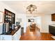 Open-concept kitchen with hardwood floors, modern lighting, and seamlessly connects to the dining area at 5307 47Th Street E Ct, Bradenton, FL 34203