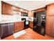 This kitchen features stainless steel appliances, wooden cabinets, and sleek countertops at 5307 47Th Street E Ct, Bradenton, FL 34203