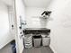 Functional laundry area with a built-in folding table and storage shelves at 5307 47Th Street E Ct, Bradenton, FL 34203