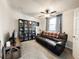 Relaxing living room with a comfortable leather couch and ample natural light at 5307 47Th Street E Ct, Bradenton, FL 34203