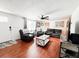 Spacious living room with hardwood floors, comfortable leather seating, and lots of natural light at 5307 47Th Street E Ct, Bradenton, FL 34203