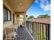 Outdoor balcony with brick flooring, chairs, and a view of the neighborhood at 5632 Ashton Lake Dr # 5632, Sarasota, FL 34231