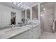 Elegant bathroom featuring dual sinks, marble countertop, and glass shower at 5632 Ashton Lake Dr # 5632, Sarasota, FL 34231