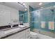 Bathroom featuring a glass shower door, sink with marble countertop, and a toilet at 5632 Ashton Lake Dr # 5632, Sarasota, FL 34231